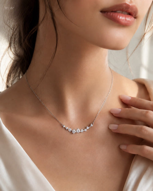 Celeste Glow silver-tone cubic zirconia cluster necklace worn by a model