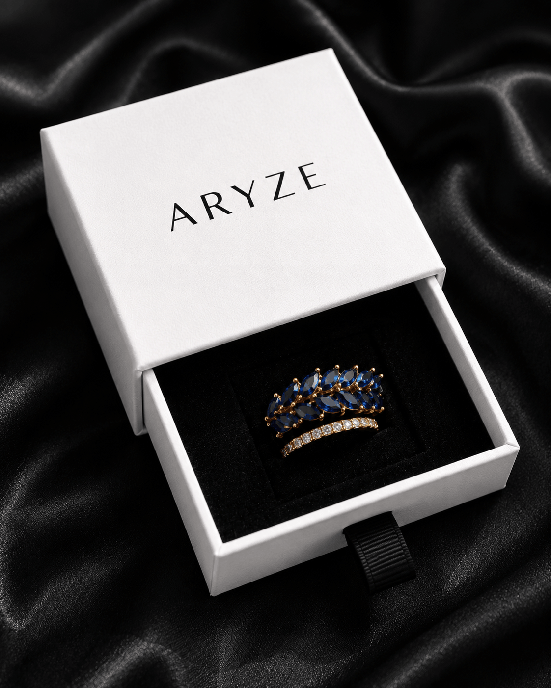 Midnight Aura gold-tone ring with blue marquise cubic zirconia presented in the branded Aryze gift box