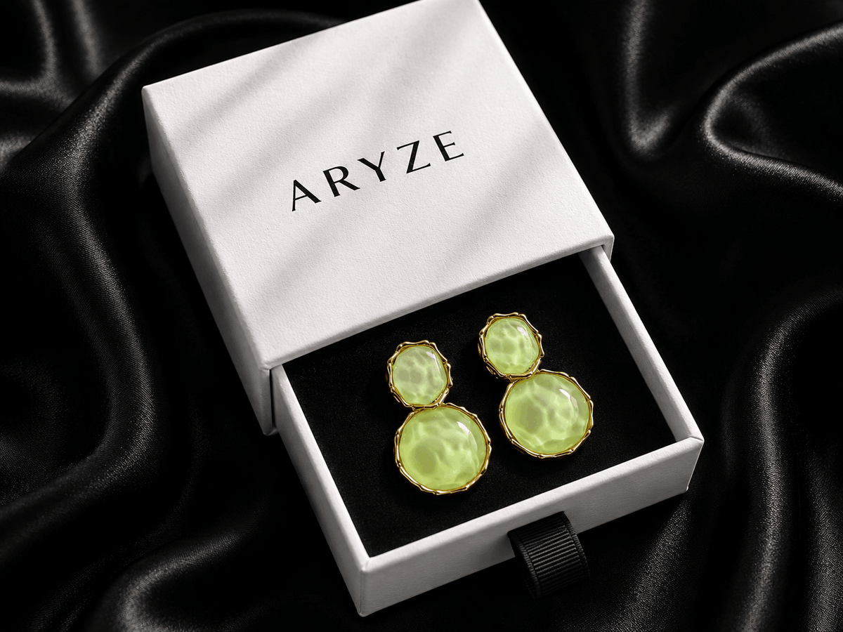 Verdant Muse gold-tone earrings with green resin stones presented in the branded Aryze gift box
