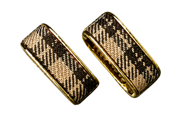 Check Luxe gold-tone wide hoop earrings with woven check pattern shown at an angle on a black background