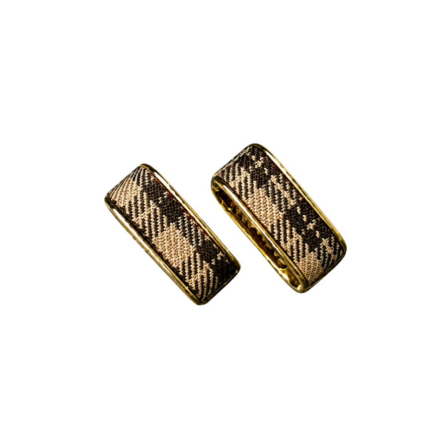 Check Luxe gold-tone wide hoop earrings with woven check pattern on a black background