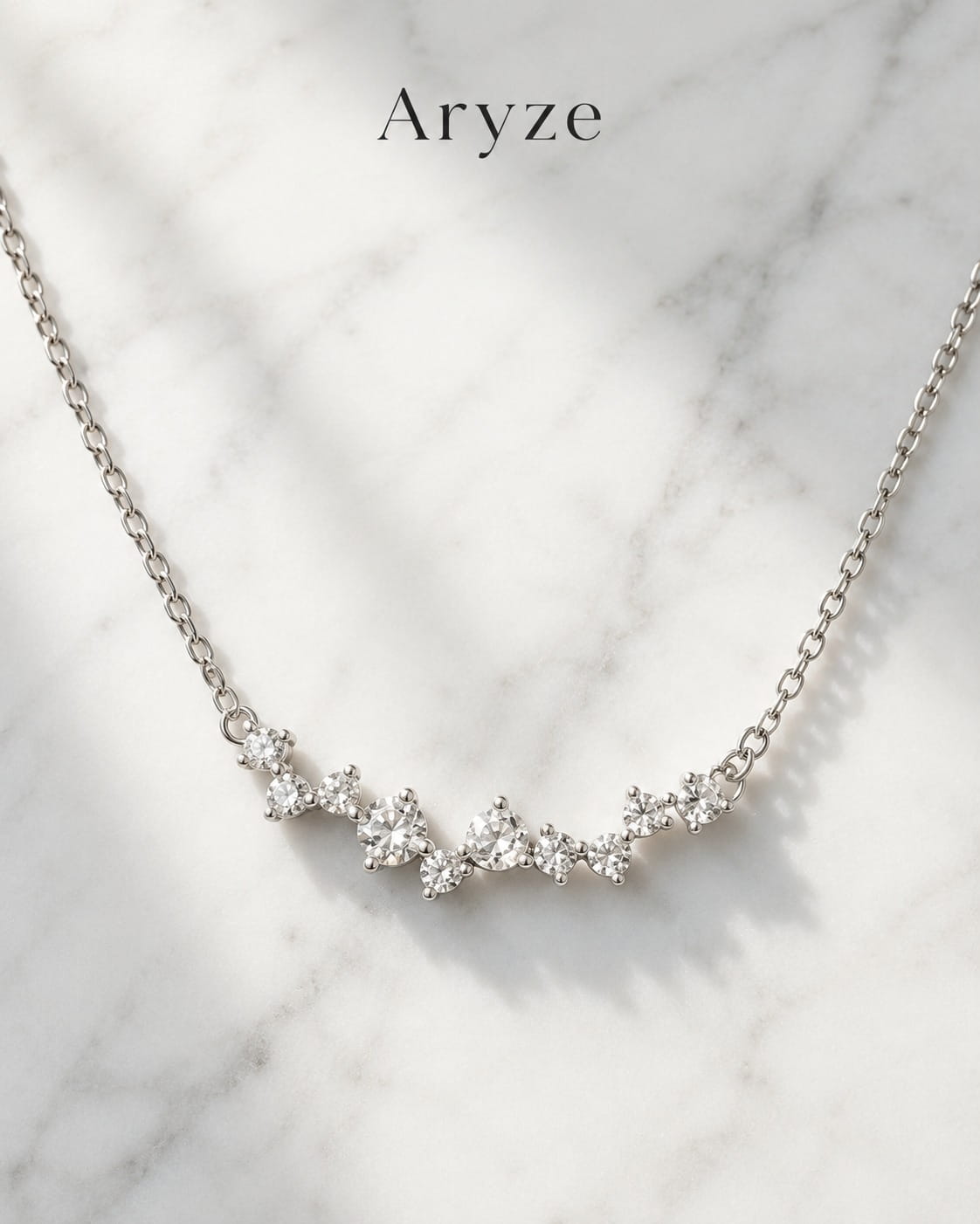Celeste Glow silver-tone cubic zirconia cluster necklace photographed on marble