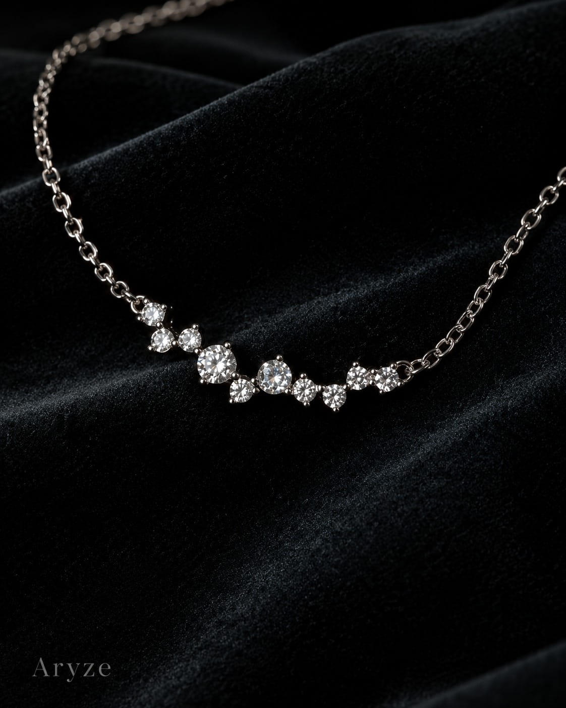 Celeste Glow silver-tone cubic zirconia cluster necklace photographed on dark velvet