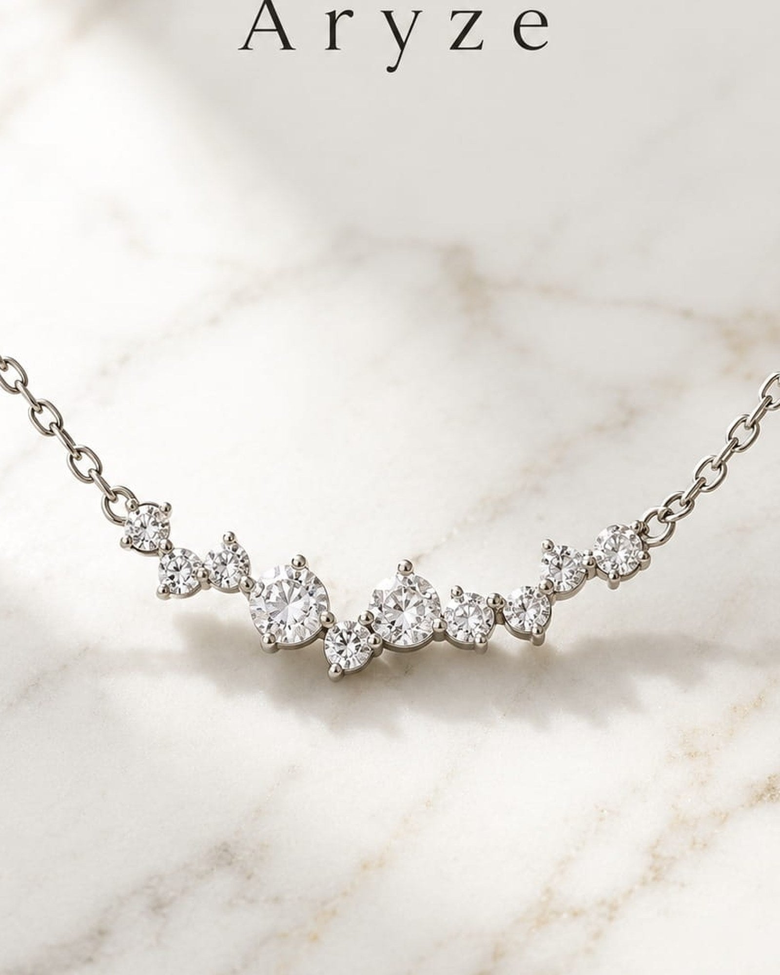 Celeste Glow silver-tone cubic zirconia cluster necklace photographed on pale marble