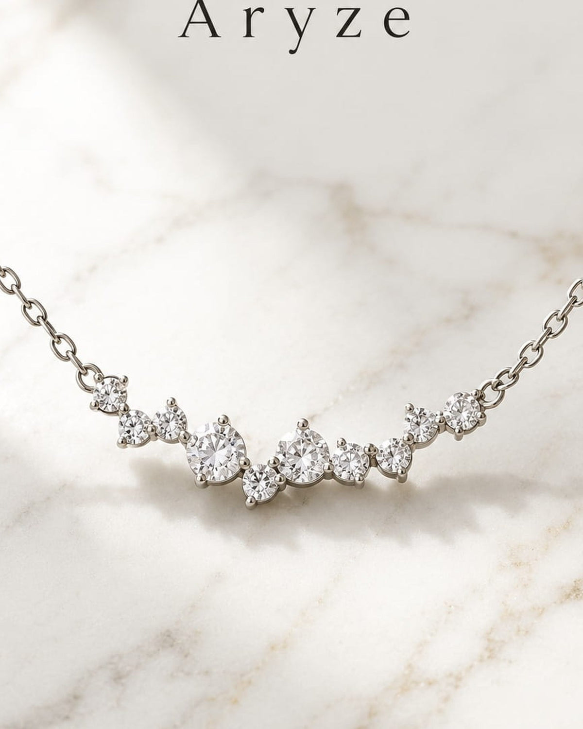 Celeste Glow silver-tone cubic zirconia cluster necklace photographed on pale marble