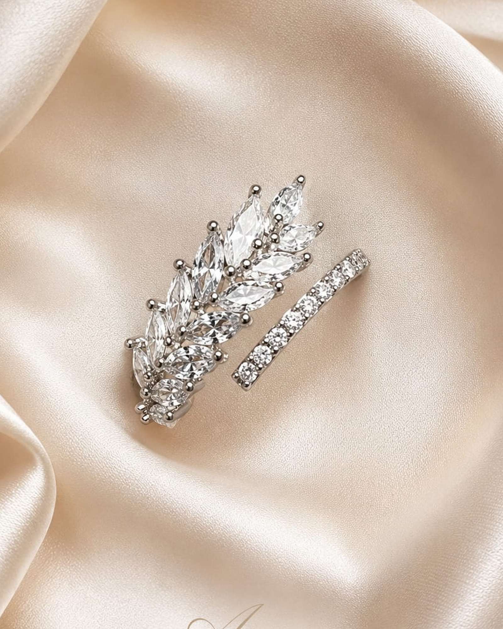Crystal Leaf silver-tone marquise cubic zirconia ring photographed on ivory satin