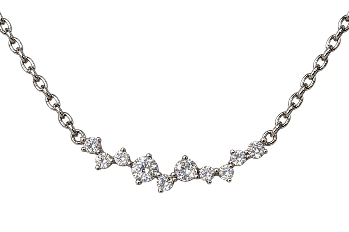 Celeste Glow silver-tone cubic zirconia cluster necklace on a black background